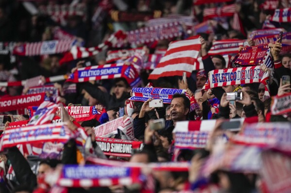 Atletico Madrid supporters cheer during the Copa del Rey round of 16 soccer match between Real Madrid and Atletico Madrid in Madrid, Spain, Thursday, Jan. 18, 2024. (AP Photo/Manu Fernandez)