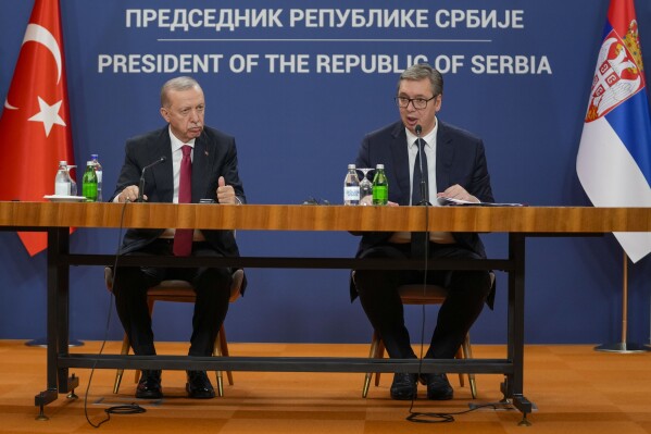 Serbian President Aleksandar Vucic, right, speaks during a news conference after talks with Turkey's President Recep Tayyip Erdogan, left, in Belgrade, Serbia, Friday, Oct. 11, 2024. (AP Photo/Darko Vojinovic)