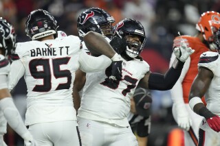 Houston Texans defensive tackle Mario Edwards Jr. (97) celebrates after sacking Chicago Bears quarterback Caleb Williams during the second half of an NFL football game Sunday, Sept. 15, 2024, in Houston. (AP Photo/Eric Christian Smith)