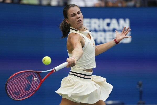 FILE - Emma Navarro, of the United States, returns a shot to Coco Gauff, of the United States, during the fourth round of the U.S. Open tennis championships, Sept. 1, in New York. 2024. (AP Photo/Pamela Smith, File)