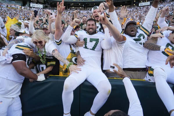 Green Bay Packers place kicker Brandon McManus (17) celebrates with fans after kicking the game-winning field goal in the second half of an NFL football game, Sunday, Oct. 20, 2024, in Green Bay, Wis. The Packers won 24-22. (AP Photo/Morry Gash)