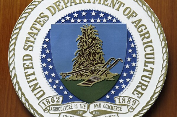 FILE - The logo of the United States Department of Agriculture is seen, Aug. 10, 2007, at the US Embassy in Berlin. (AP Photo/Michael Sohn, File)