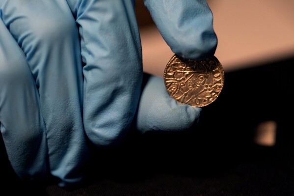 An Edward the Confessor Pyramid coin (1065-6), part of the Chew Valley Hoard of 2,584 coins, buried in the turmoil following the Norman Invasion of Britain in 1066, on display at the British Museum in London, Tuesday, Oct. 22, 2024, the hoard is valued at £4.3 million pounds, (US$5.58 million), a record find. (AP Photo/Alastair Grant)