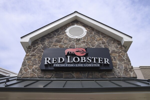 FILE - Signage at a Red Lobster restaurant, May 20, 2024, in Lincolnwood, Ill. (AP Photo/Teresa Crawford, File)