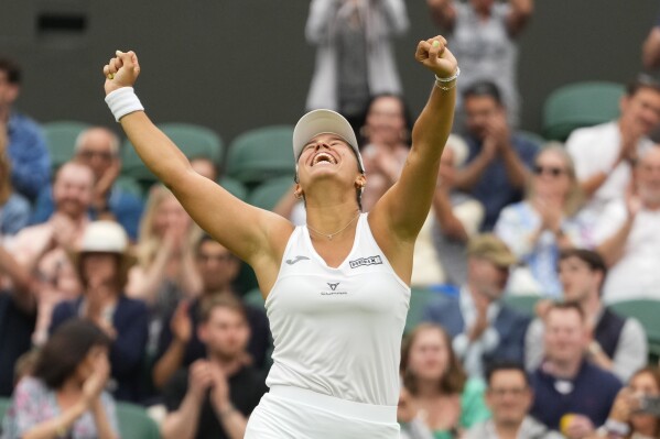 Jessica Bouzas Maneiro of Spain celebrates after defeating Marketa Vondrousova of the Czech Republic during their first round match at the Wimbledon tennis championships in London, Tuesday, July 2, 2024. (AP Photo/Kirsty Wigglesworth)