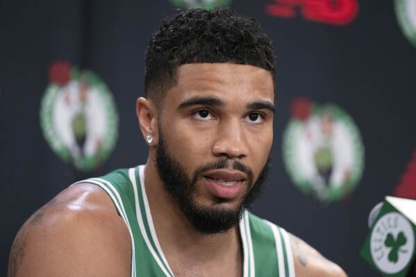 Boston Celtics' Jayson Tatum speaks at a news conference during the NBA basketball team's media day, Tuesday, Sept. 24, 2024, in Boston. (AP Photo/Michael Dwyer)