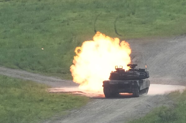 A U.S. Army's M1A2 Abrams tank from the 1st Armored Brigade Combat Team fires during a live firing drill at Rodriguez Live Fire Complex in Pocheon, South Korea, Wednesday, Aug. 14, 2024. (AP Photo/Ahn Young-joon)