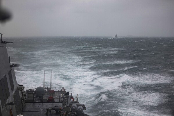 In this photo released by U.S. Navy, the Arleigh Burke-class guided-missile destroyer USS Higgins (DDG 76) conducts bilateral operations with Royal Canadian Navy Halifax-class frigate HMCS Vancouver (FFH 331) during routine operations in the Taiwan strait Sunday, Oct. 20, 2024. (Mass Communications Specialist 3rd Class Trevor Hale/U.S. Navy via AP)