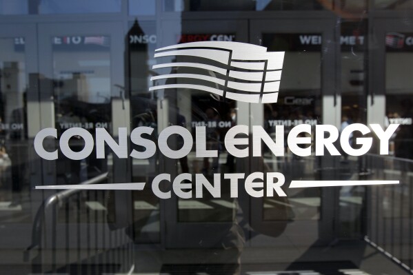 FILE - In this Aug. 18, 2010, file photo, the CONSOL Energy Center is reflected in Pittsburgh. (AP Photo/Keith Srakocic, file)