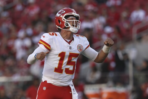 Kansas City Chiefs quarterback Patrick Mahomes (15) celebrates after a touchdown by Mecole Hardman during the second half of an NFL football game against the San Francisco 49ers in Santa Clara, Calif., Sunday, Oct. 20, 2024. (AP Photo/Jed Jacobsohn)