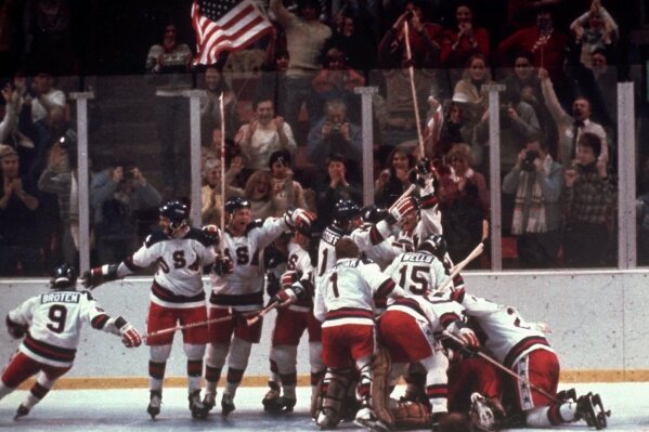 FILE - In this Feb. 22, 1980, file photo, the U.S. hockey team celebrates with goalie Jim Craig after a 4-3 victory against the Soviet Union in a medal round match at the the 1980 Winter Olympics in Lake Placid, N.Y. (AP Photo/File)