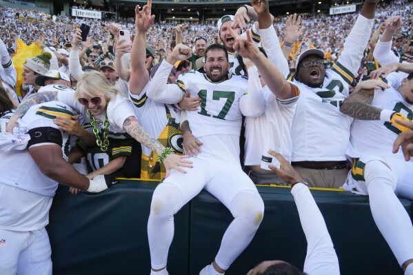 Green Bay Packers place kicker Brandon McManus (17) celebrates with fans after kicking the game-winning field goal in the second half of an NFL football game, Sunday, Oct. 20, 2024, in Green Bay, Wis. The Packers won 24-22. (AP Photo/Morry Gash)