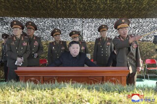 CORRECTS DAY OF WEEK OF TRANSMISSION - In this undated photo provided on Sunday, Oct. 6, 2024 by the North Korean government, North Korean leader Kim Jong Un, center, watches an artillery exercise at an undisclosed place in North Korea. Independent journalists were not given access to cover the event depicted in this image distributed by the North Korean government. The content of this image is as provided and cannot be independently verified. Korean language watermark on image as provided by source reads: "KCNA" which is the abbreviation for Korean Central News Agency. (Korean Central News Agency/Korea News Service via AP)