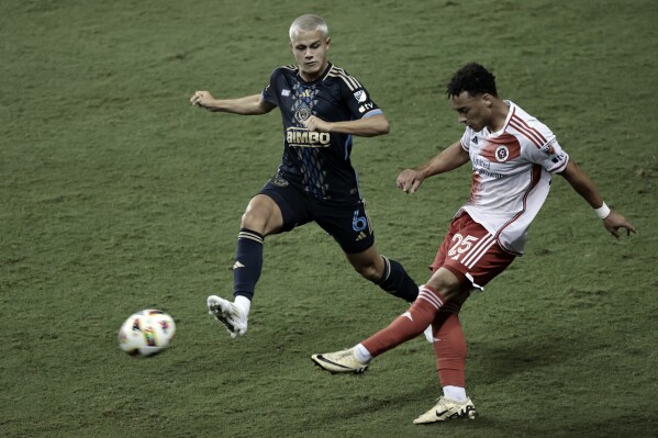 Philadelphia Union's Cavan Sullivan puts pressure on New England's Peyton Miller during an MLS soccer game at Subaru Park in Chester, Pa. on Wednesday, July 17, 2024. (Elizabeth Robertson/The Philadelphia Inquirer via AP)