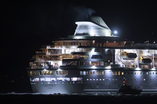 The Villa Vie Odyssey cruise ship leaves Belfast Harbour after the luxury cruise ship became marooned in Belfast, Northern Ireland, for four months due to unexpected repair works, Monday, Sept. 30, 2024. (Liam McBurney/PA via AP)