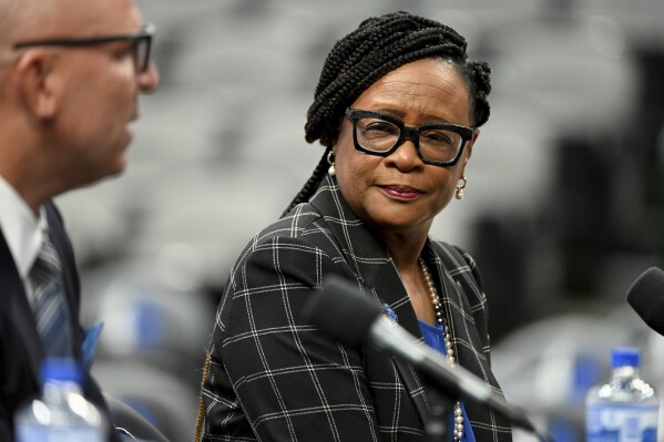 FILE - Dallas Mavericks CEO Cynt Marshall looks on as new head coach Jason Kidd speaks at an introductory press conference, Thursday, July 15, 2021, in Dallas. (AP Photo/Matt Strasen, File)