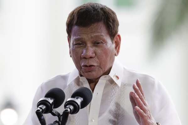 FILE - Philippine President Rodrigo Duterte gestures during a speech at the anniversary of the proclamation of the Philippine independence rites on Saturday, June 12, 2021, at the Provincial Capitol of Bulacan province, Philippines. (AP Photo/Aaron Favila, file)