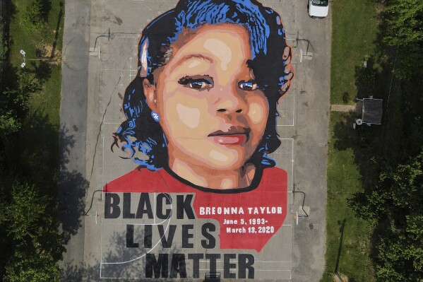 FILE - A ground mural depicting a portrait of Breonna Taylor is seen at Chambers Park in Annapolis, Md., July 6, 2020. (AP Photo/Julio Cortez, File)